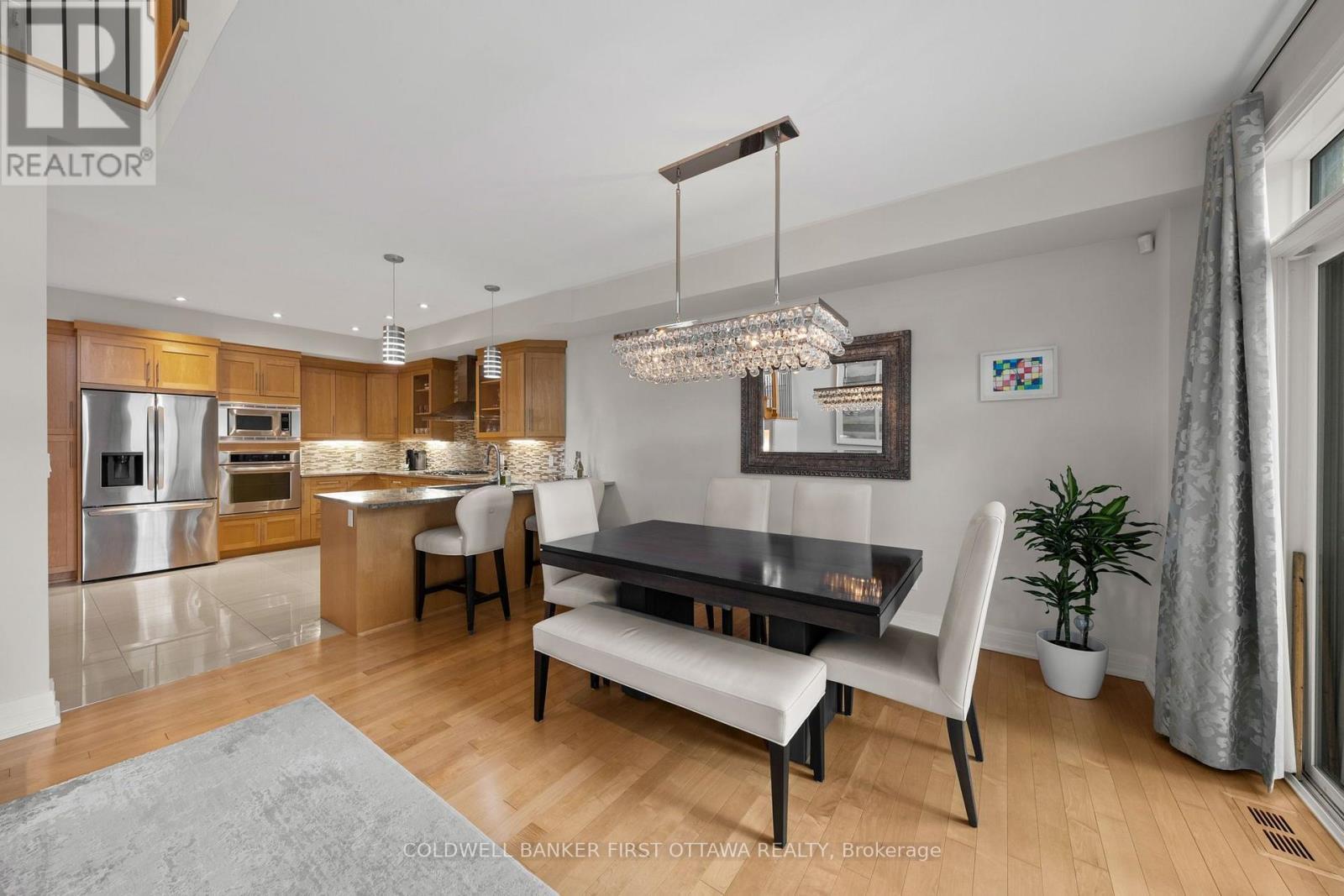 Dining area with elegant chandelier. - 155 Nora Street, Ottawa, ON