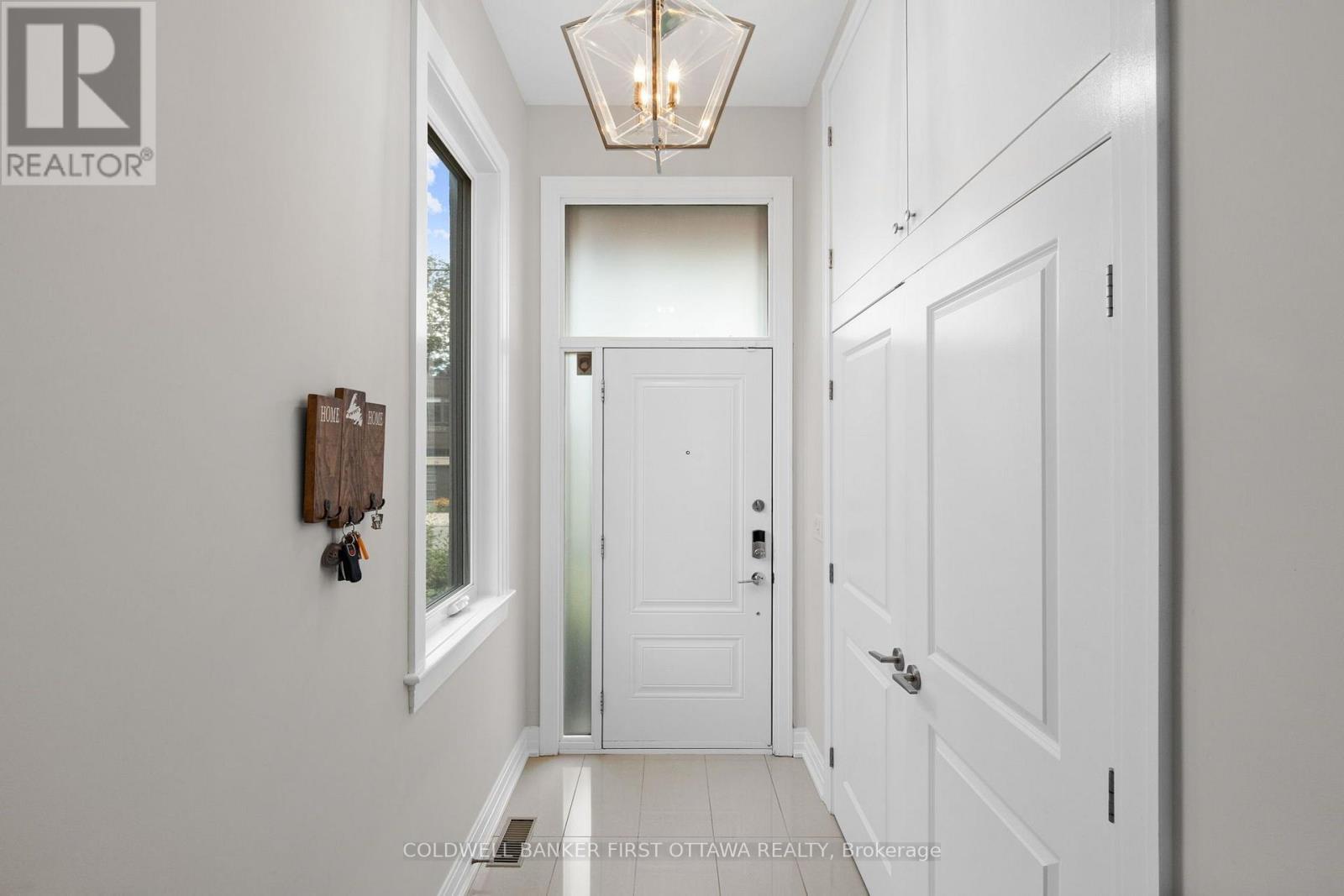 Bright & welcoming tiled front foyer & closet. - 155 Nora Street, Ottawa, ON