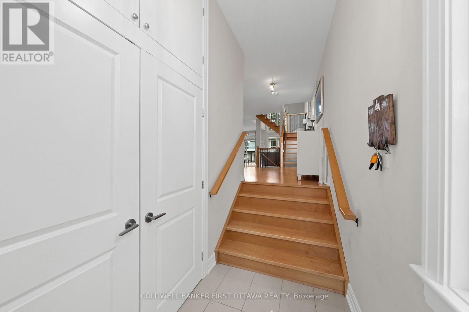 Double door closet & step up into main level. - 155 Nora Street, Ottawa, ON