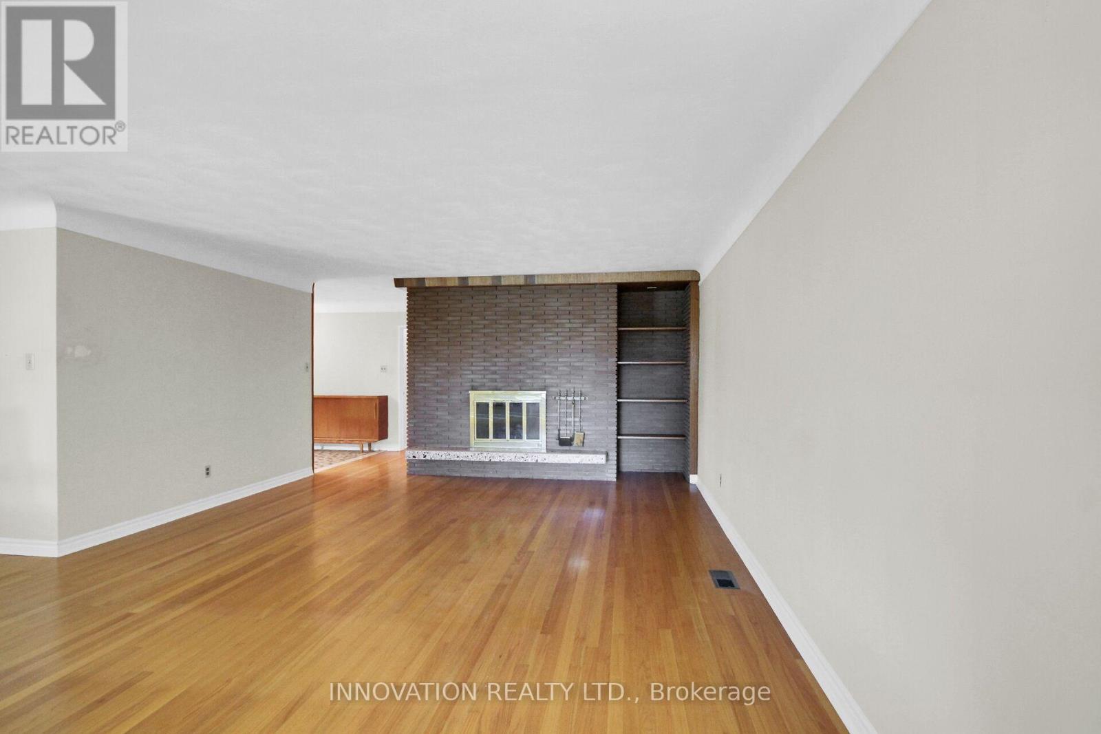 Beautiful living room and brick fireplace - 1136 Castle Hill Crescent, Ottawa, ON