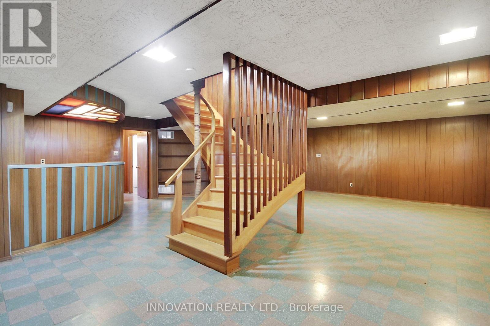 Lower level curved staircase - 1136 Castle Hill Crescent, Ottawa, ON