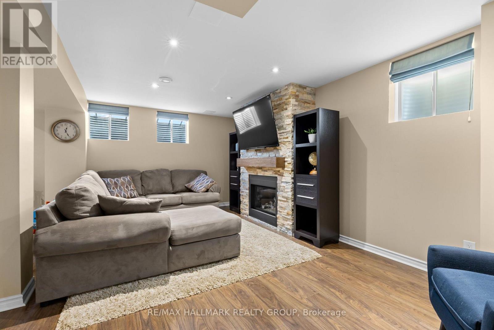 Basement family room with gas fireplace - 223 Serra Ridge, Ottawa, ON