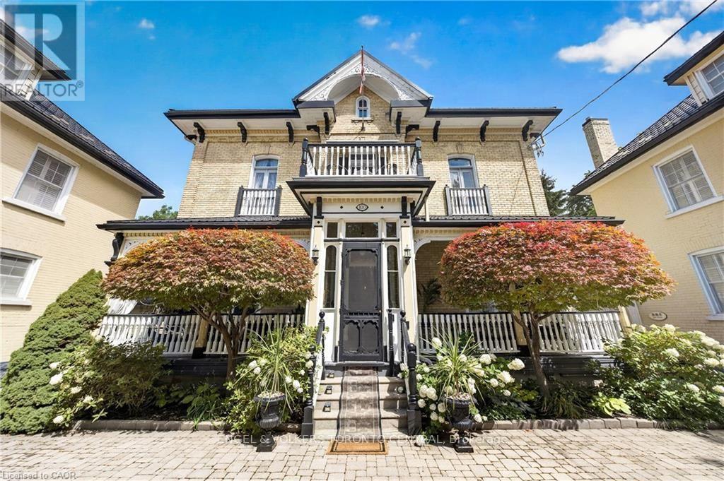 Brick exterior with decorative corbels - 100 Brunswick Street, Stratford, ON