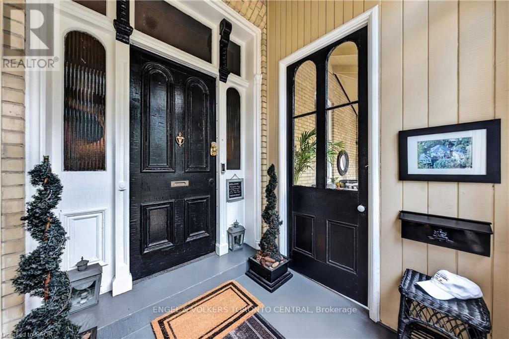 Exterior entryway with a paneled door - 100 Brunswick Street, Stratford, ON