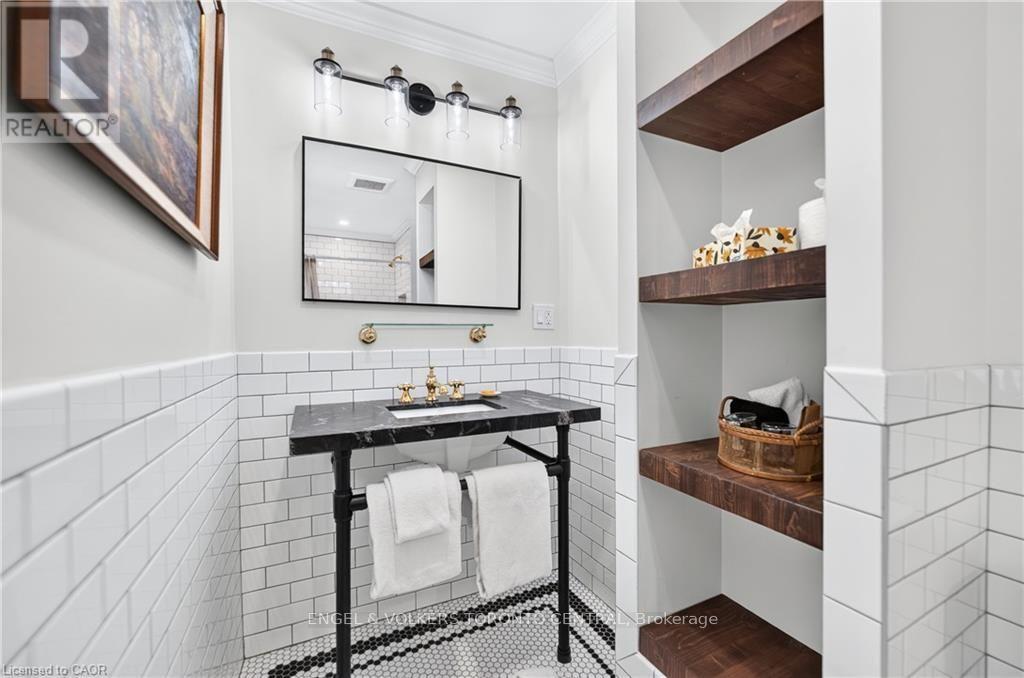 Subway tile wainscoting with a mosaic tile - 100 Brunswick Street, Stratford, ON