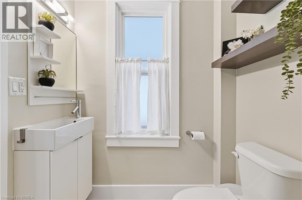 Modern vanity with integrated rectangular sink and chrome faucet - 87 Strathcona Avenue, Brantford, ON