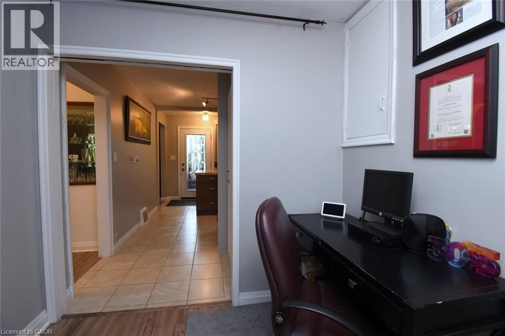 Wood-finish flooring with a tiled hallway - 154 Ewen Road, Hamilton, ON