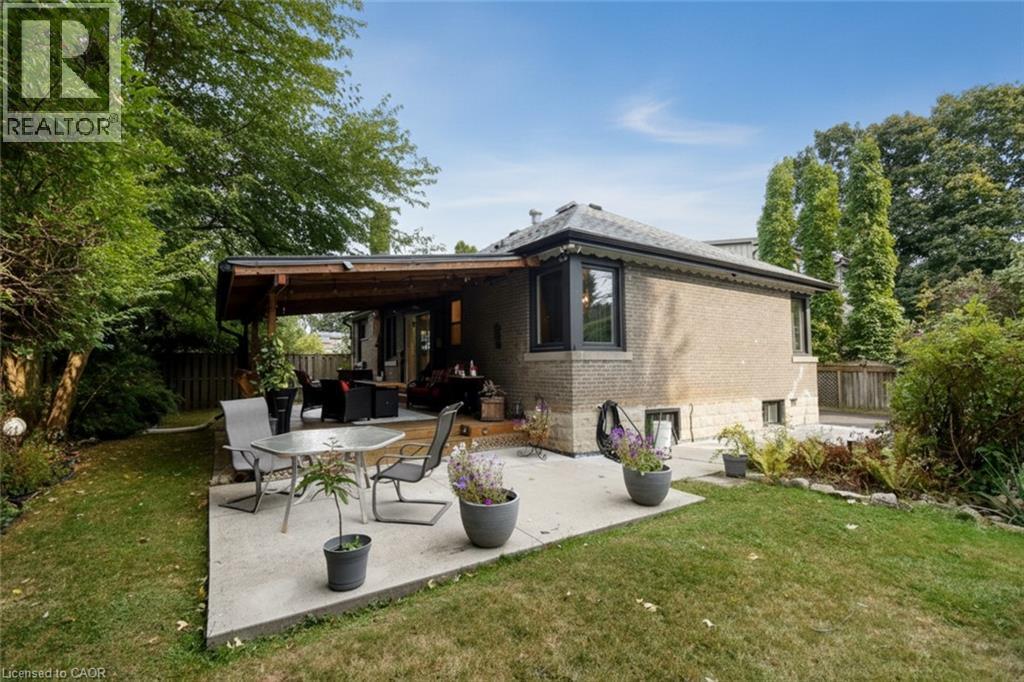 Brick exterior with multiple windows - 154 Ewen Road, Hamilton, ON