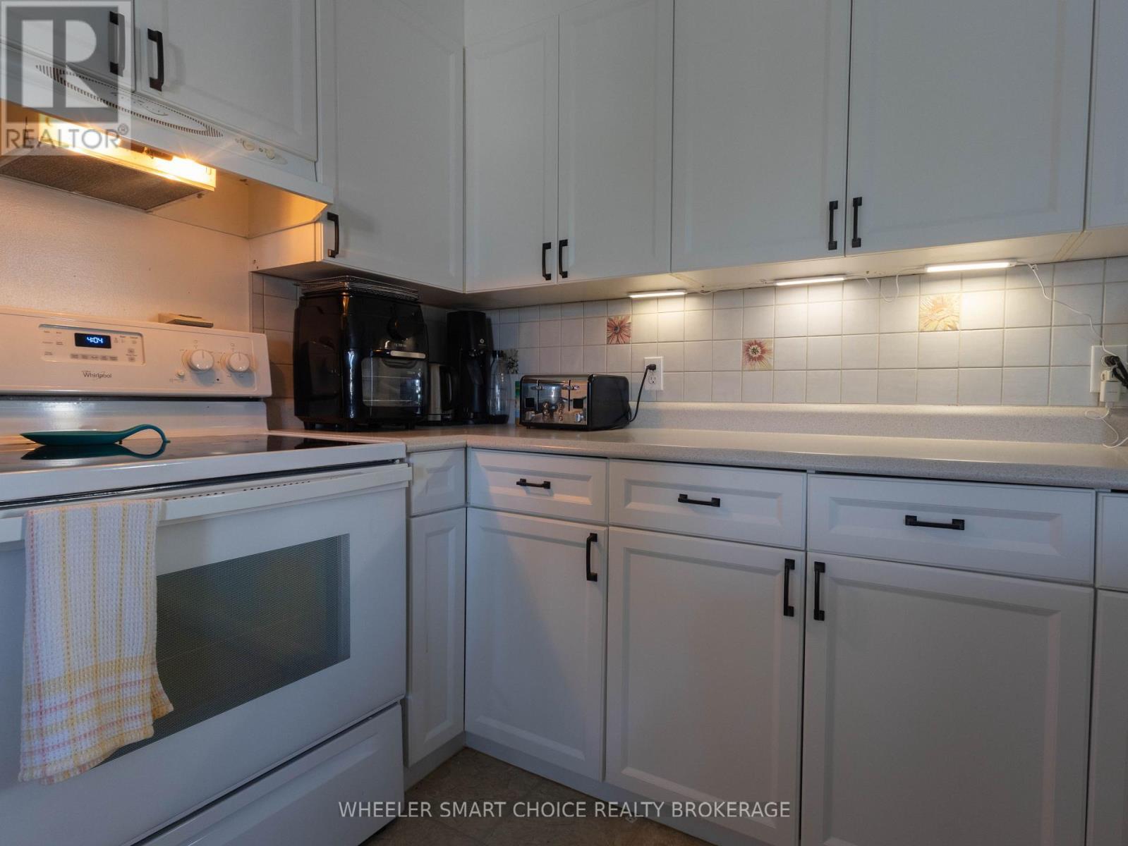 Newer white cupboards and under mount lighting - 78 Maple Street, South Stormont, ON