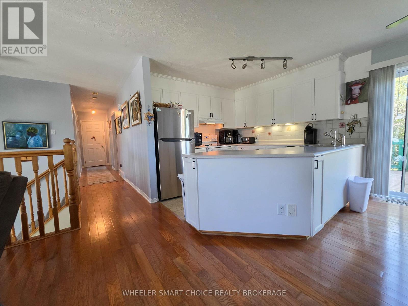 A view of the kitchen and the hallway - 78 Maple Street, South Stormont, ON