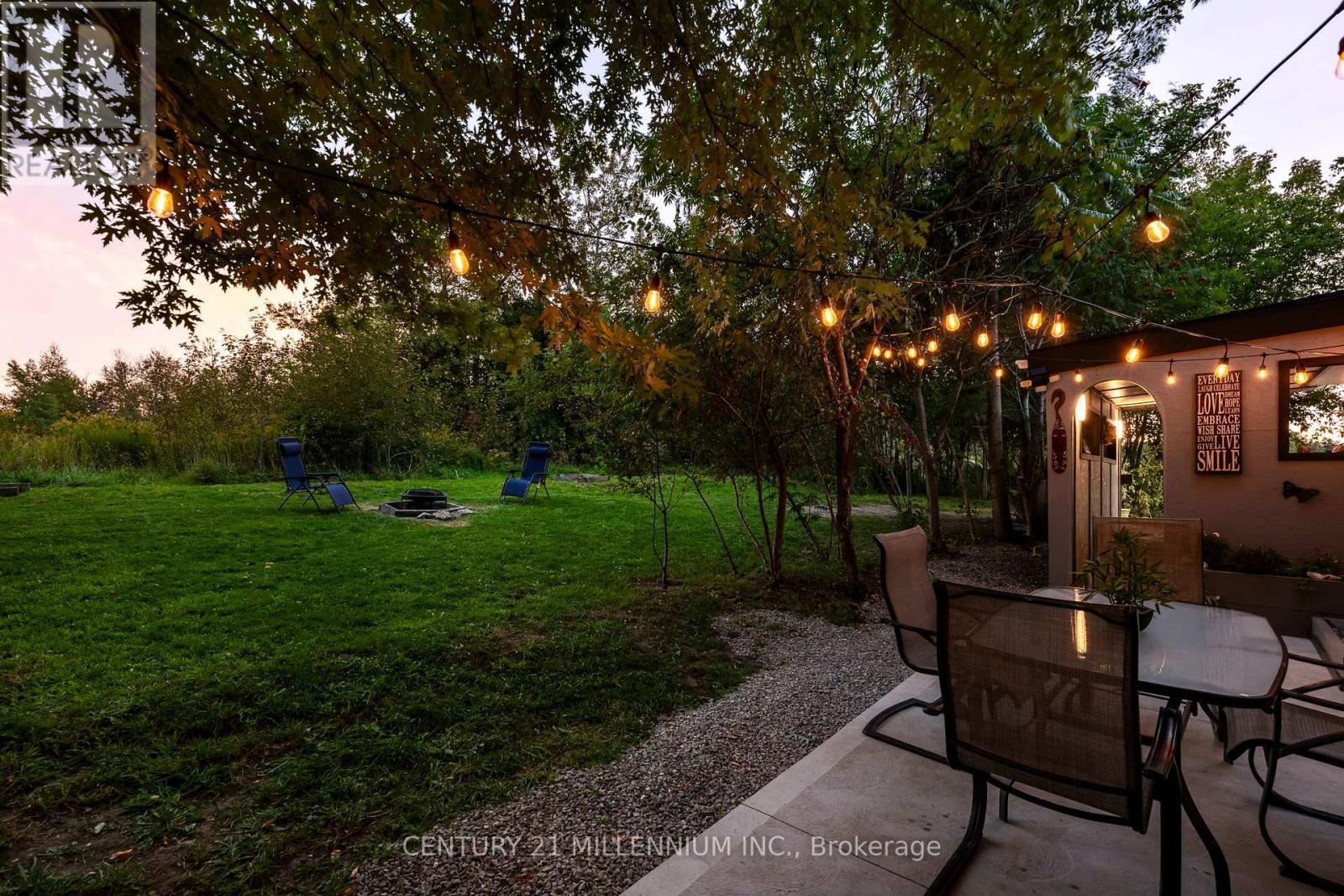 Patio looking out to the yard - 139 Town Line, Orangeville, ON
