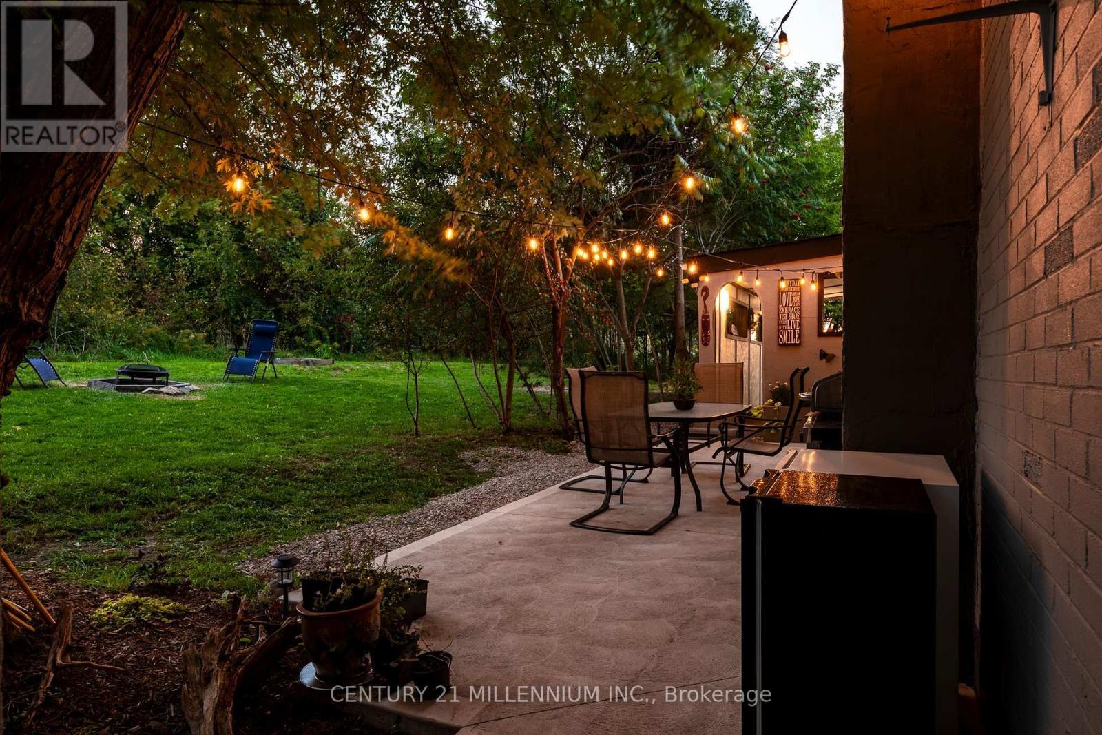 Patio at dusk - 139 Town Line, Orangeville, ON