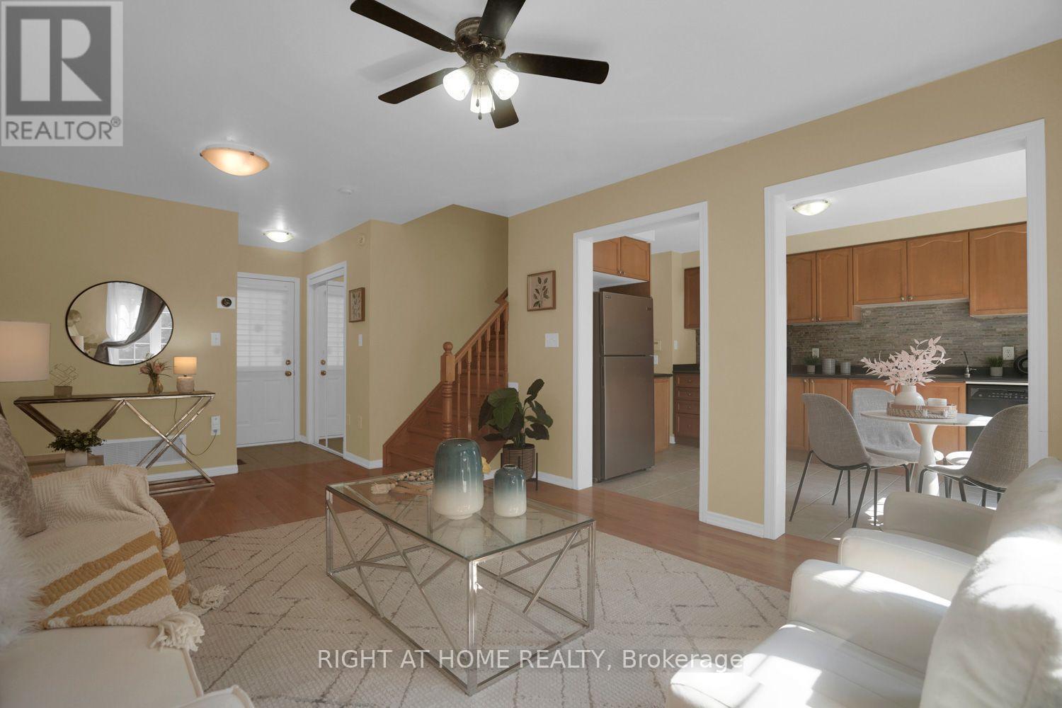Open flow from living room to kitchen - 84 Dougherty Crescent, Whitchurch-Stouffville, ON