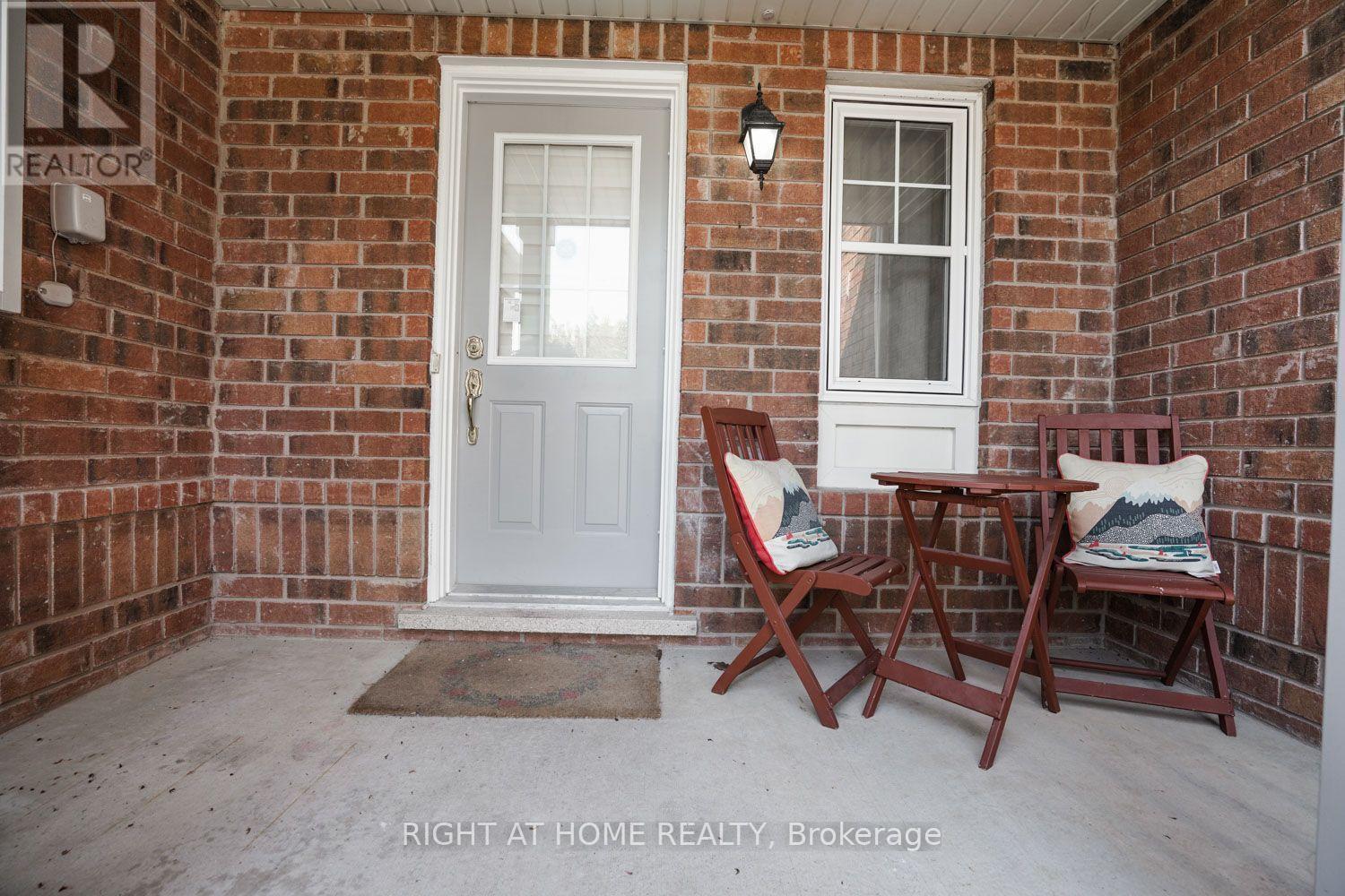 Relaxing covered porch seating - 84 Dougherty Crescent, Whitchurch-Stouffville, ON