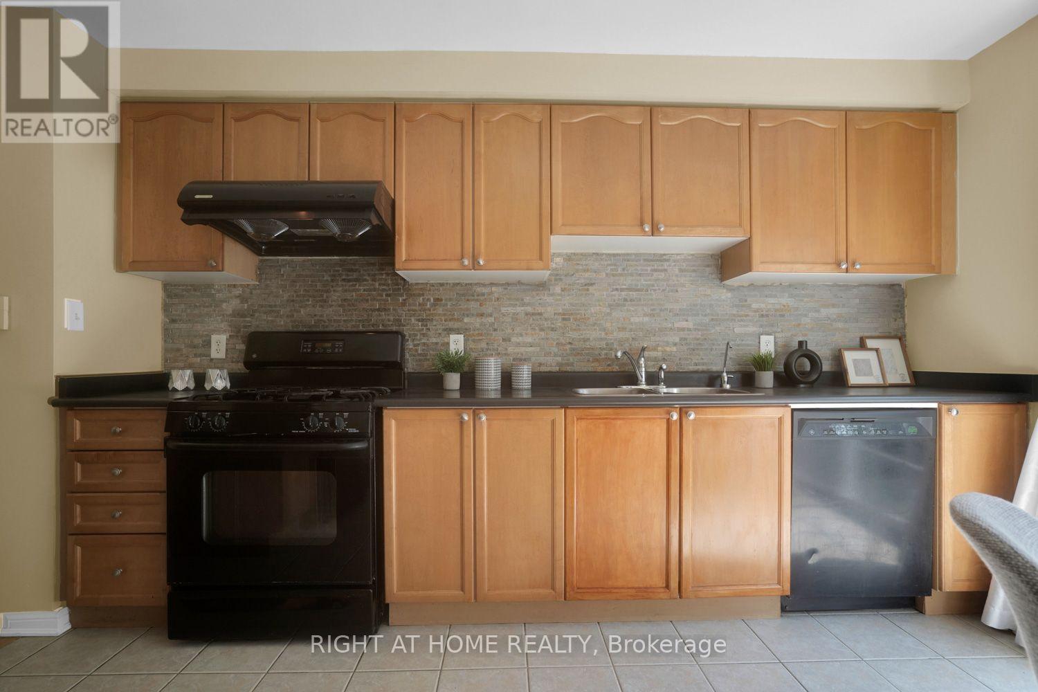 Stacked stone backsplash - 84 Dougherty Crescent, Whitchurch-Stouffville, ON