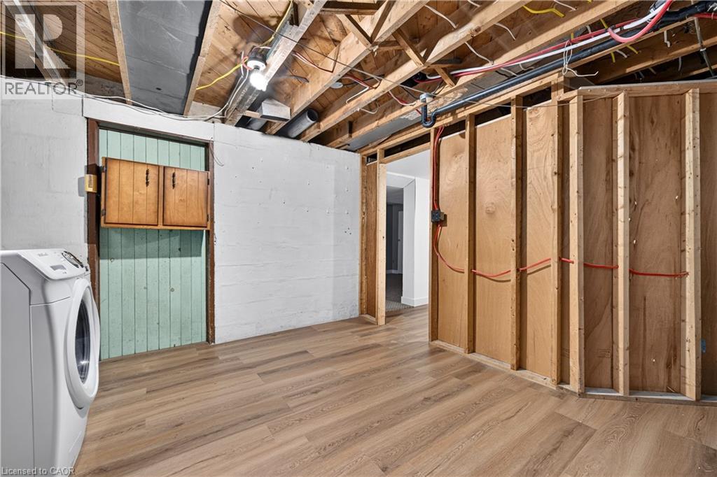 Wood-finish flooring with exposed ceiling joists and wood-framed walls - 176 Avalon Place, Kitchener, ON