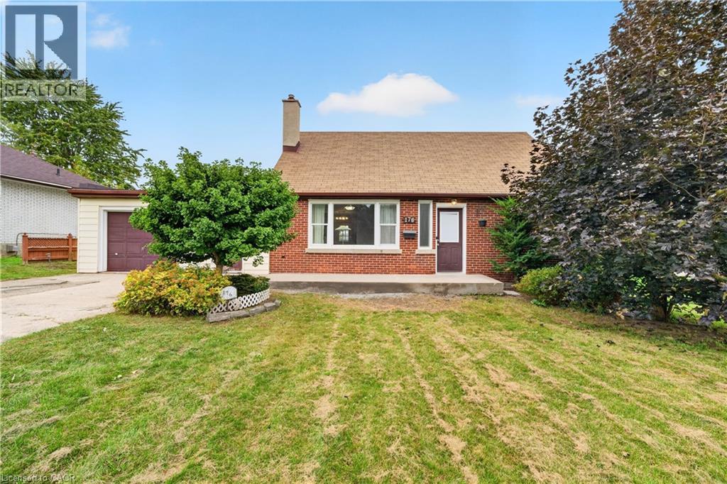 Red brick exterior, shingle roof, concrete porch, attached garage with brown door, and mature landscaping - 176 Avalon Place, Kitchener, ON
