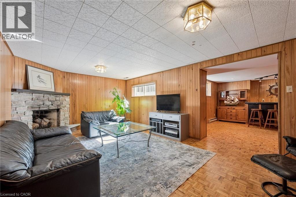 Rec room with wood burning fireplace - 19 Christine Crescent, Kitchener, ON