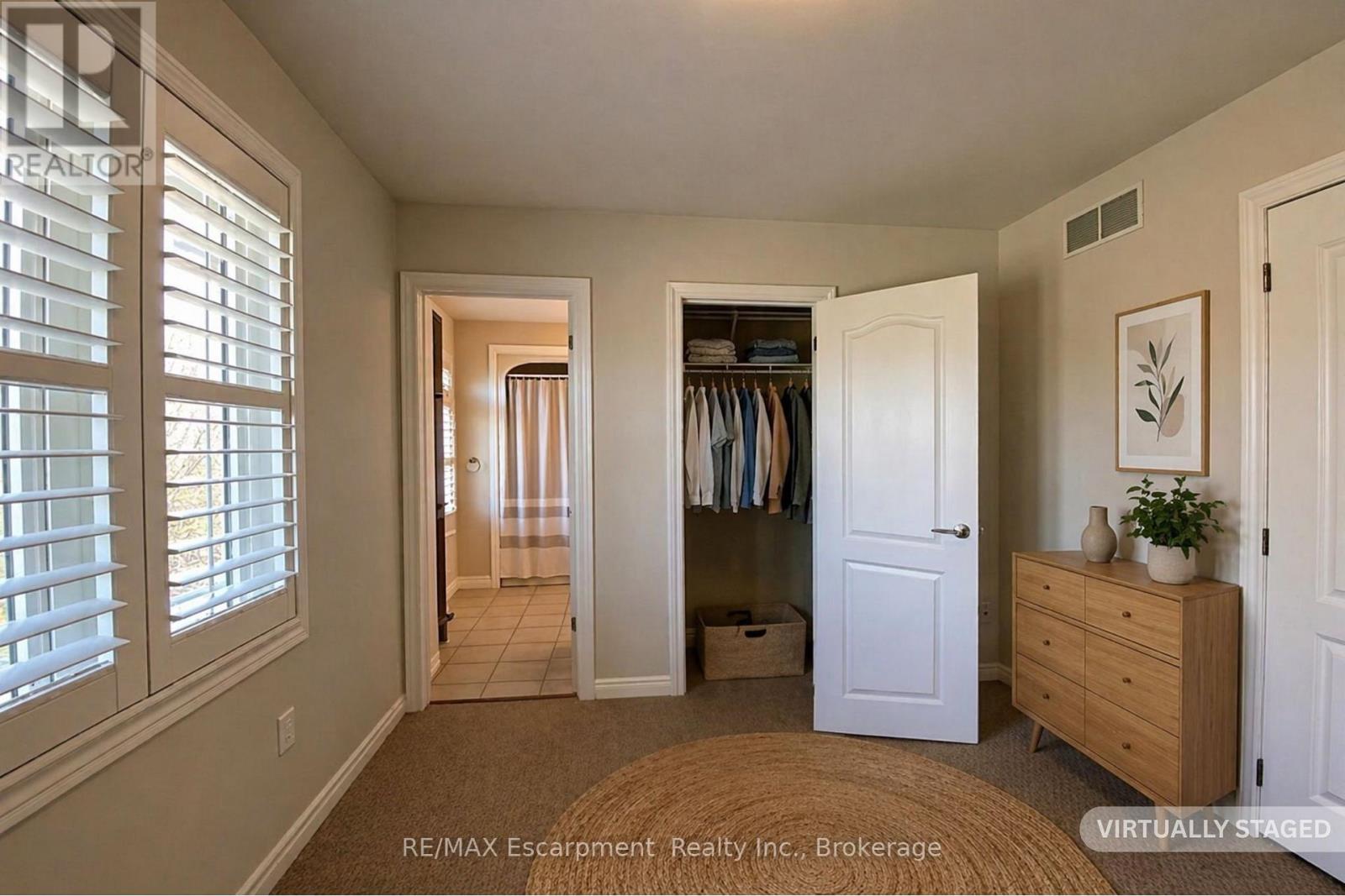 virtually staged closet and bath - 2430 Second Street, Burlington (Brant), ON