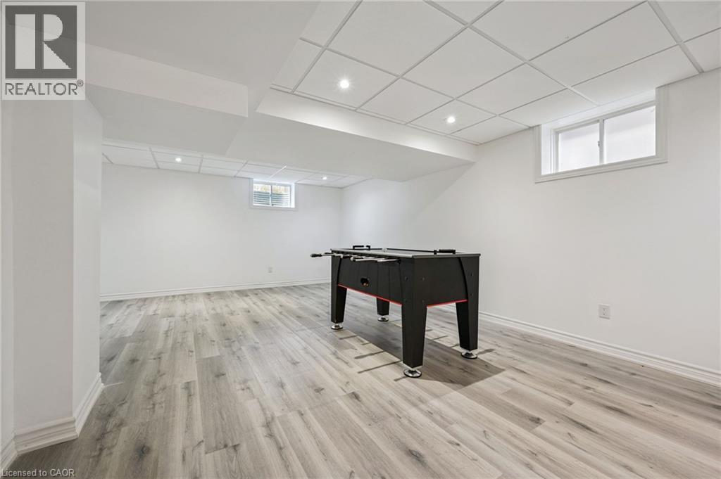 Recessed lighting, drop ceiling, light wood-finish flooring, and white walls - 154 Falconridge Drive, Kitchener, ON