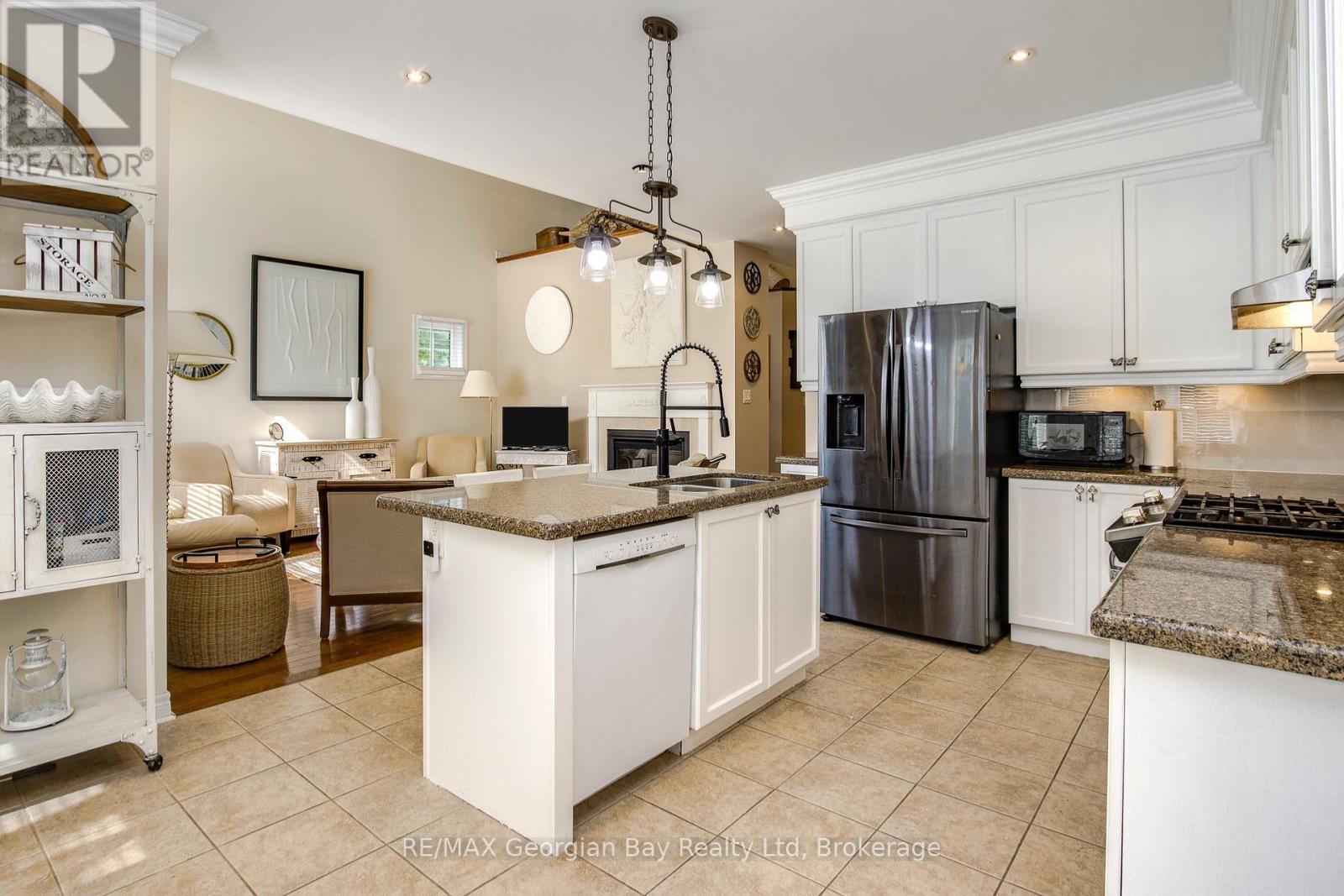 open kitchen to living room - 68 Riverwalk Place, Midland, ON