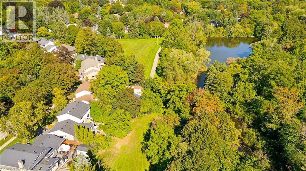 Mature tree canopy, residential properties, open green space, natural water body - 351 Craigleith Drive, Waterloo, ON