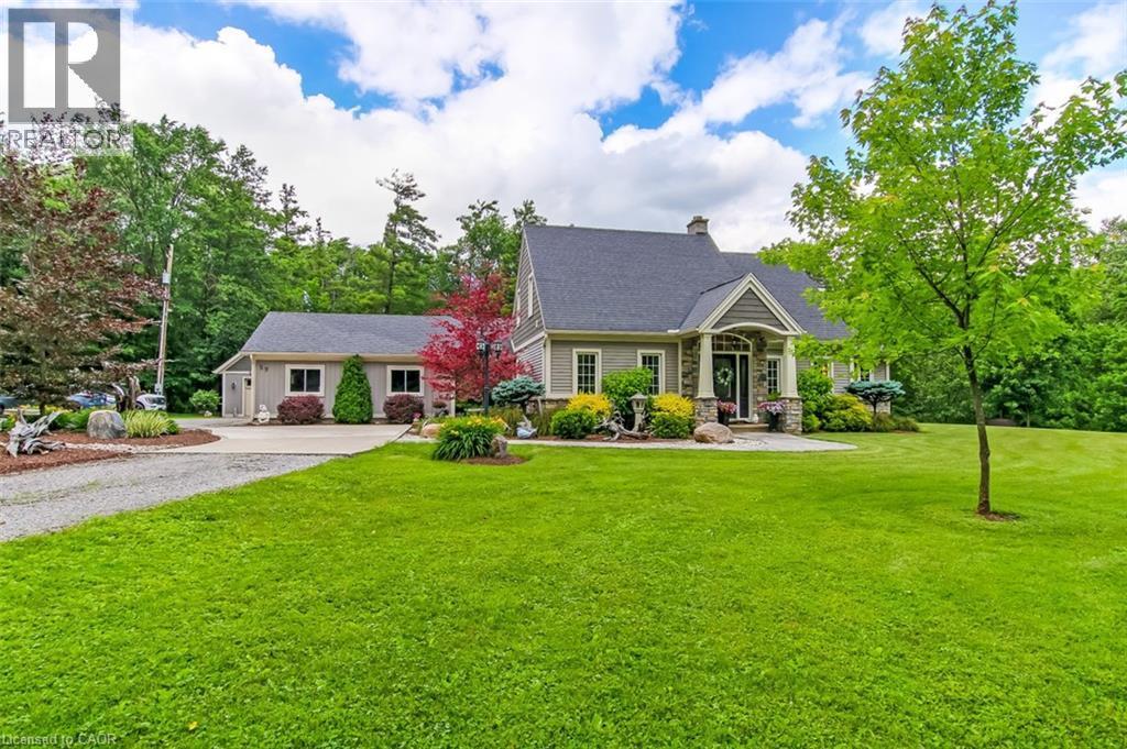 This large home sits on 1.5 acres of beautifully landscaped property - 59 Decou Road, Simcoe, ON