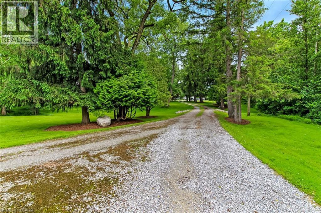 The long driveway fronts on Decou Rd. - 59 Decou Road, Simcoe, ON