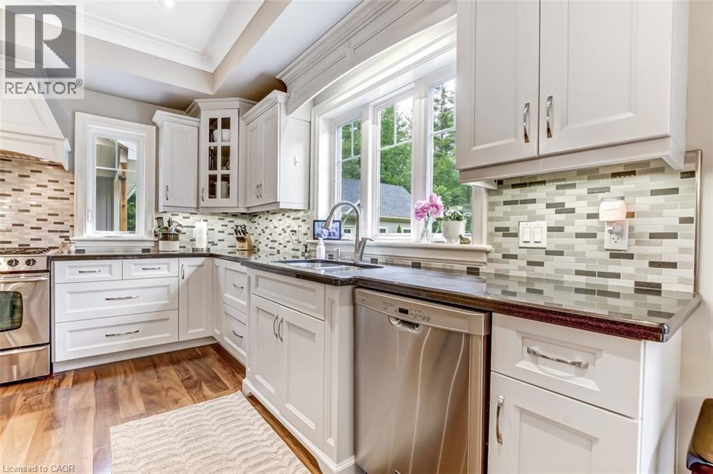 The large window overlooks the scenic back yard and allows lots of natural light in. - 59 Decou Road, Simcoe, ON