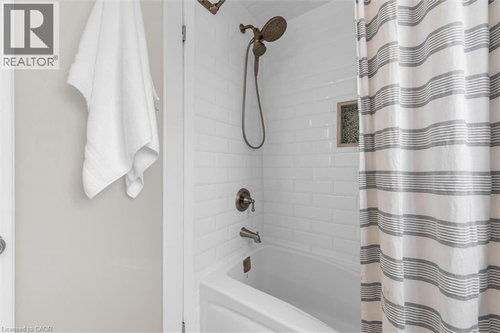 Bathroom with shower / tub combo with curtain - 5 Viking Court Unit# 301, Grimsby, ON