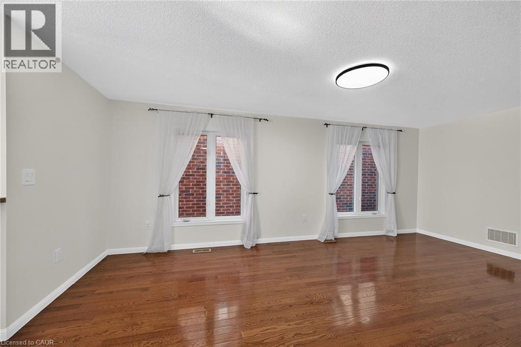 Hardwood flooring, recessed lighting, and dual windows - 103 Emick Drive, Ancaster, ON