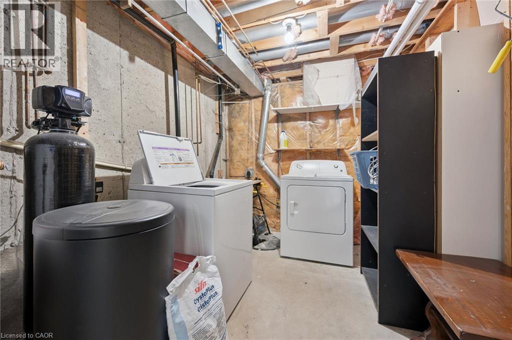 Concrete foundation walls with exposed wood framing and ceiling joists - 512 Thorndale Drive, Waterloo, ON