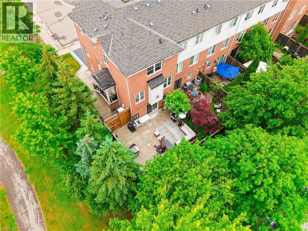 Brick exterior with multiple windows - 2435 Coho Way, Oakville, ON