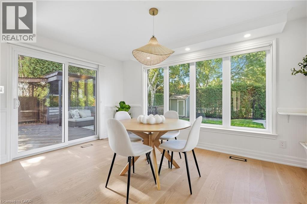 Light wood-finish flooring with white walls - 4159 Spruce Avenue, Burlington, ON