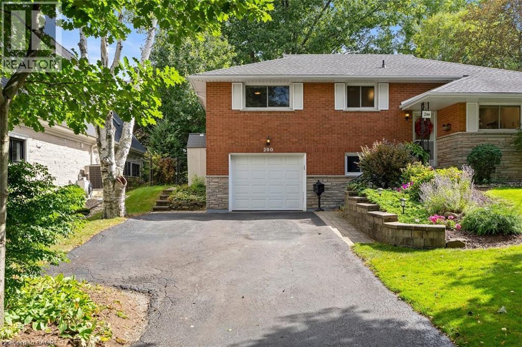 Front yard view showing mature trees and generous front yard space - 200 Woodview Crescent, Ancaster, ON