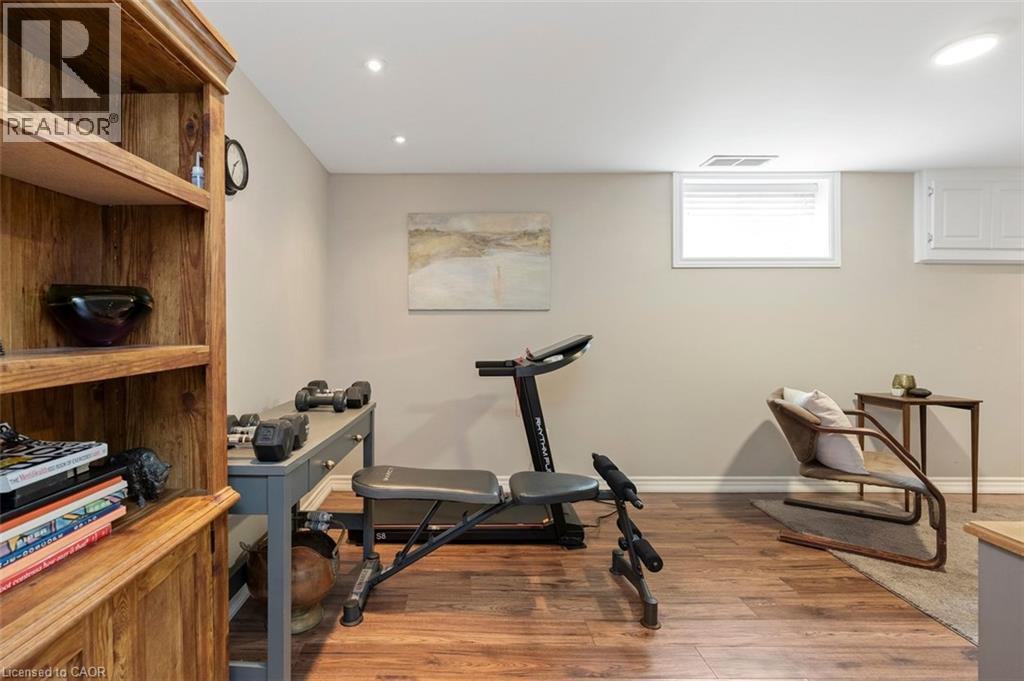 Lower level recreation room flexible for tv room, exercise room, home office or guests - 200 Woodview Crescent, Ancaster, ON