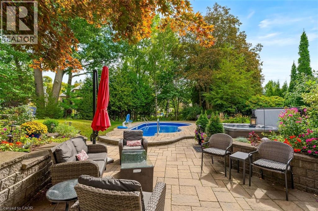 Outdoor patio space with picturesque landscaping - 200 Woodview Crescent, Ancaster, ON