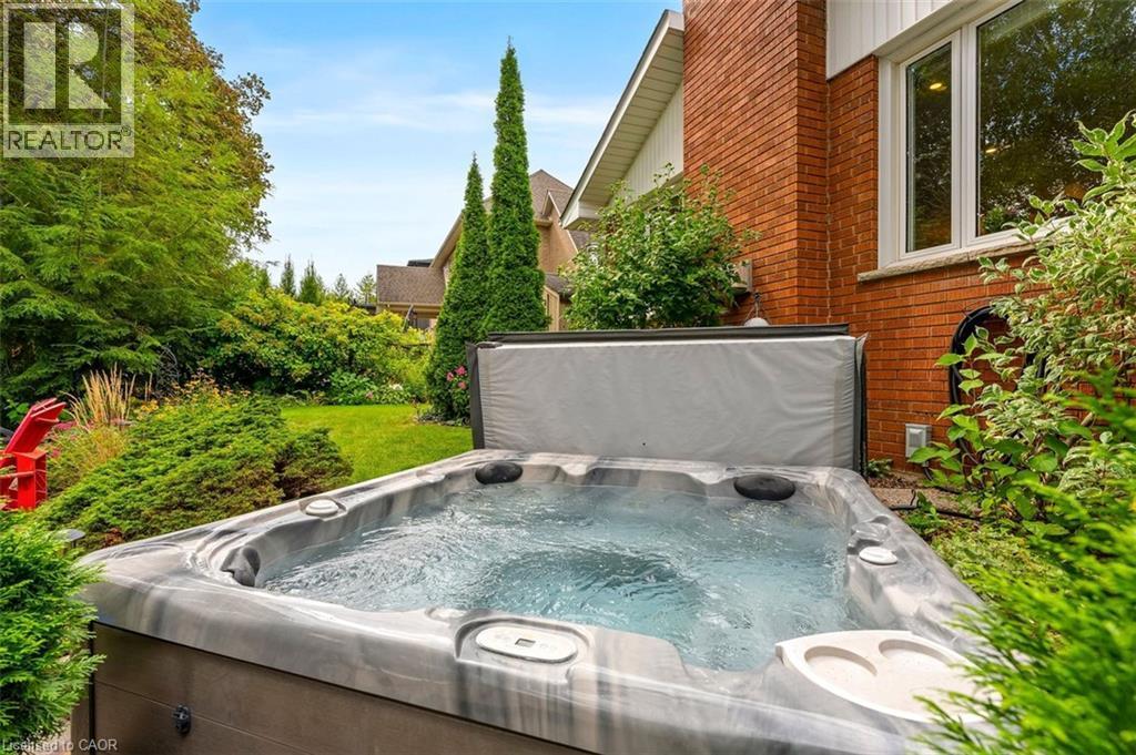Backyard inground pool view from back of yard toward home - 200 Woodview Crescent, Ancaster, ON