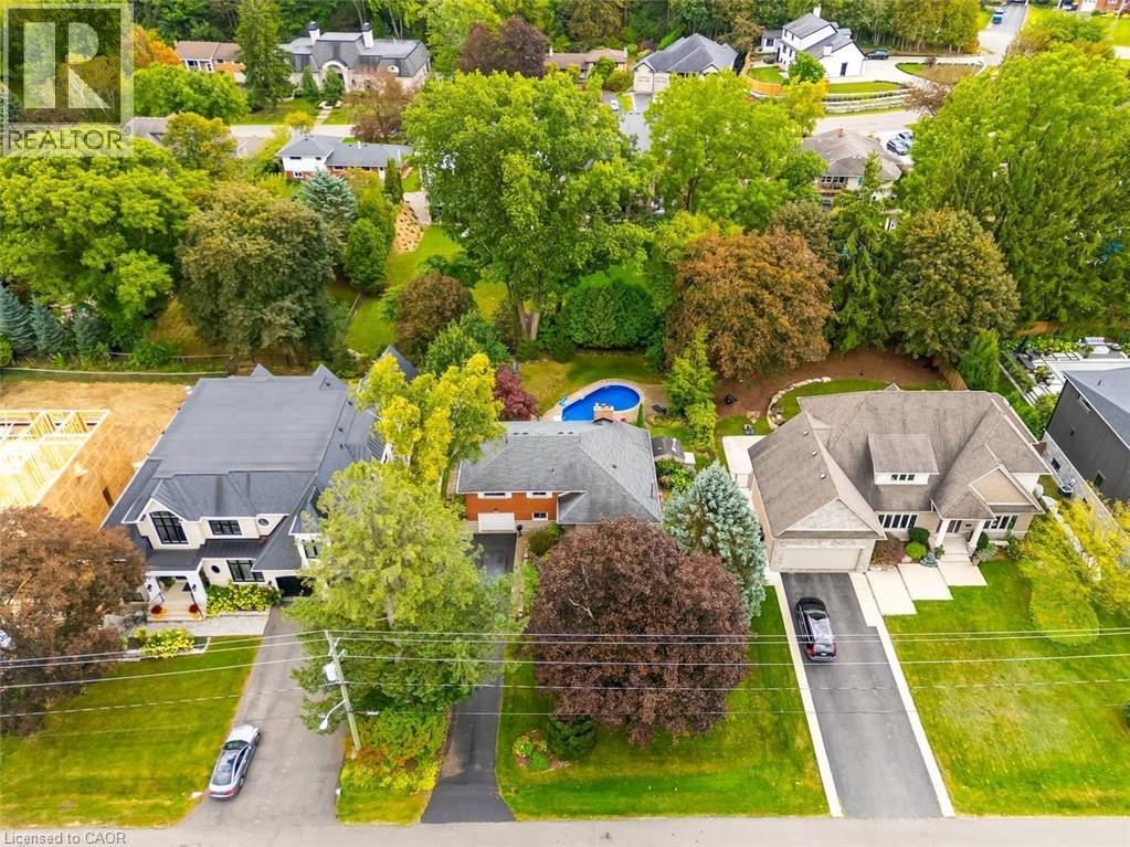 Aerial view of Expansive lot with mature trees, paved driveway, and established landscaping - 200 Woodview Crescent, Ancaster, ON
