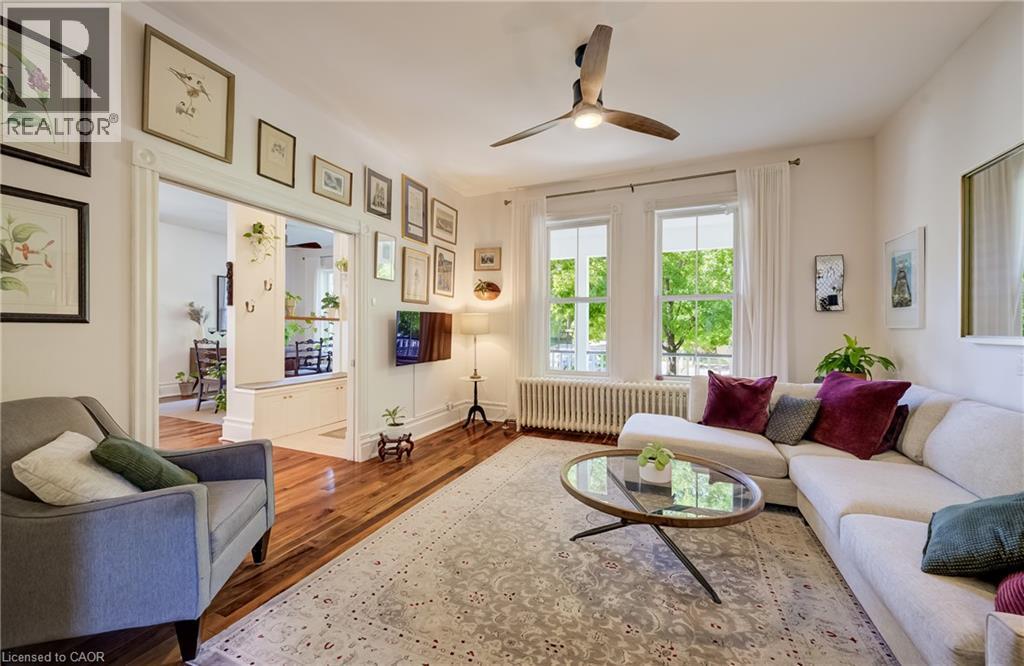 Hardwood flooring, tall windows, and a ceiling fan - 59 Allen Street W, Waterloo, ON