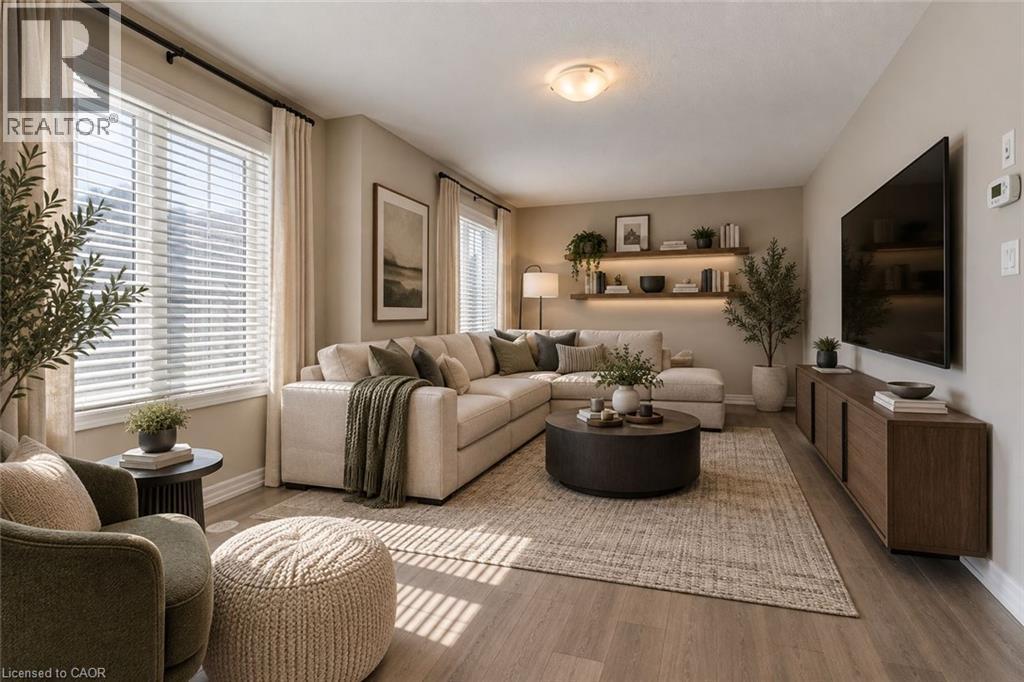 Wood-finish flooring, recessed lighting, built-in floating shelving with integrated lighting, and dual large windows with blinds - 212 Ellen Davidson Drive, Oakville, ON