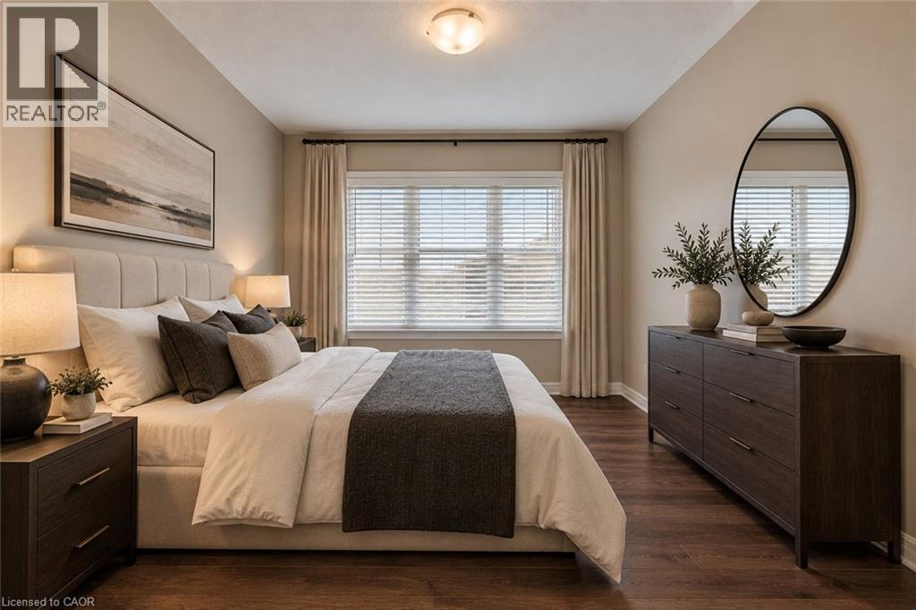 Recessed lighting, wood-finish flooring, and a large window with blinds - 212 Ellen Davidson Drive, Oakville, ON