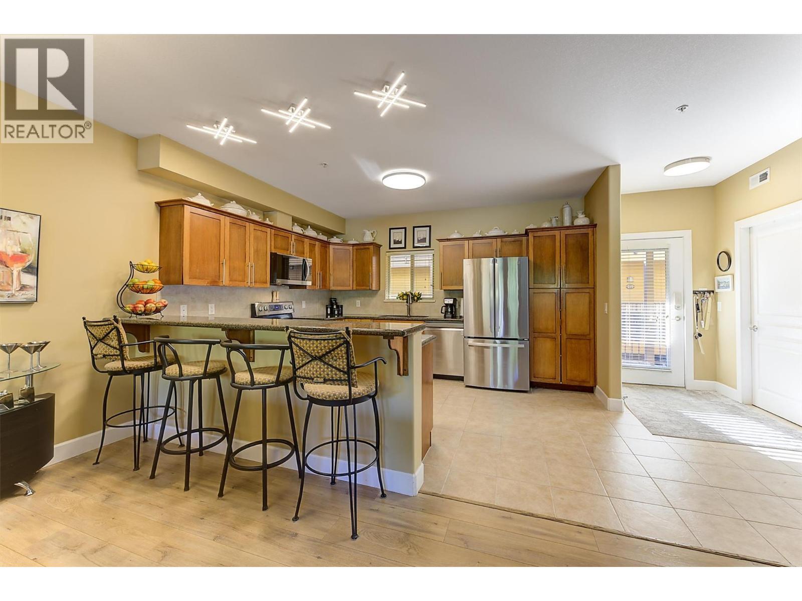 Raised Eating Bar in Kitchen. - 3996 Beach Avenue Unit# 236, Peachland, BC