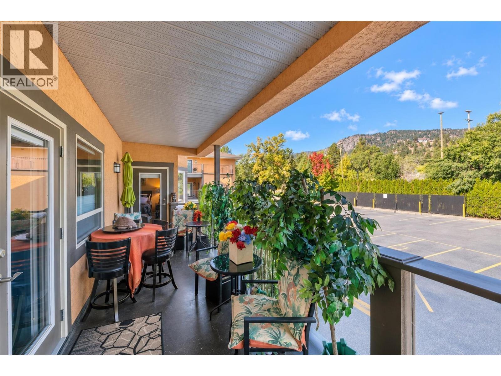 Deck with Mountain Views. - 3996 Beach Avenue Unit# 236, Peachland, BC
