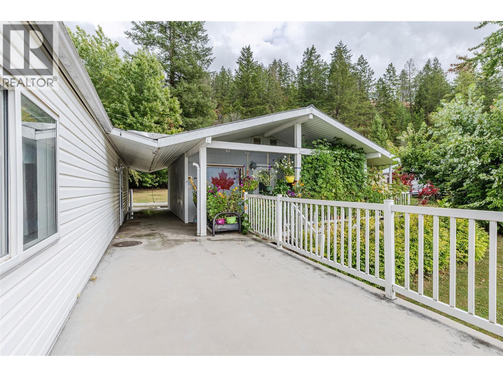 Deck off of 1993 Dartmouth and front of Cabin - 1-2780 Rocky Point Road, Creston, BC