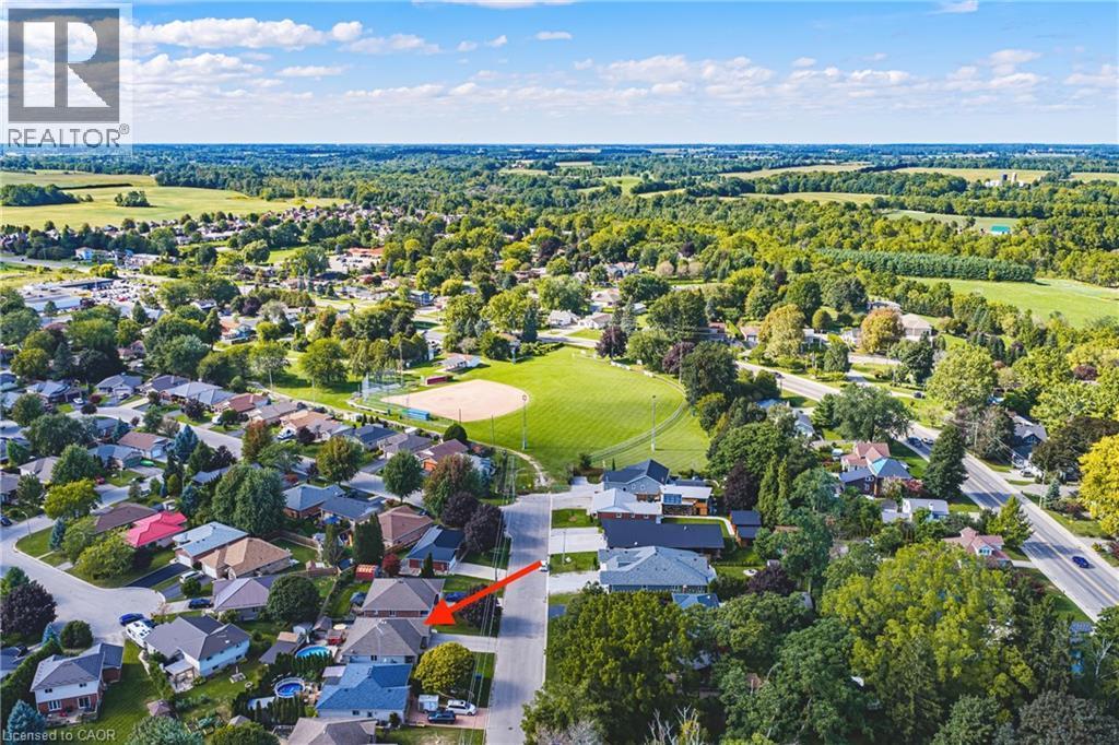 Residential neighborhood setting with extensive green spaces and mature tree cover - 915 St George Street, Port Dover, ON