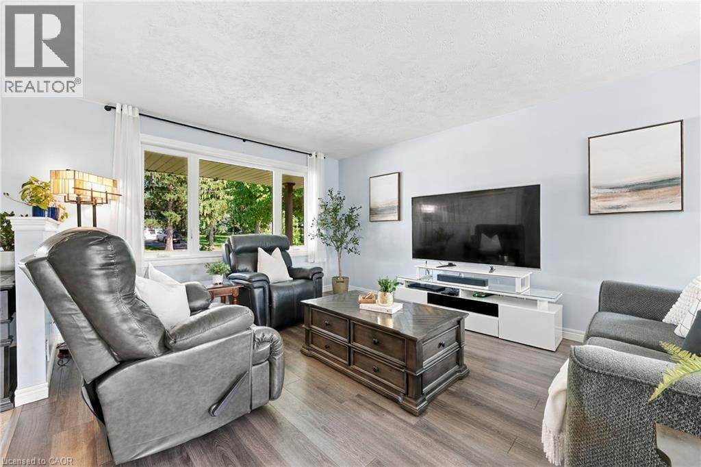 Spacious interior with wood-finish flooring and light-toned walls - 915 St George Street, Port Dover, ON