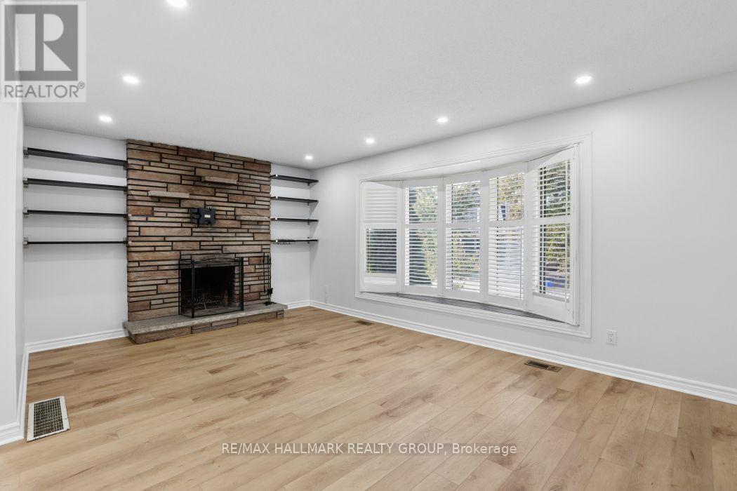 Living room with FP and bow window. - 211 Harcourt Avenue, Ottawa, ON