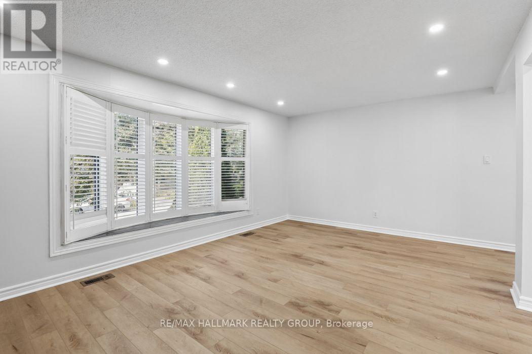 Huge bow window floods the space in light. - 211 Harcourt Avenue, Ottawa, ON