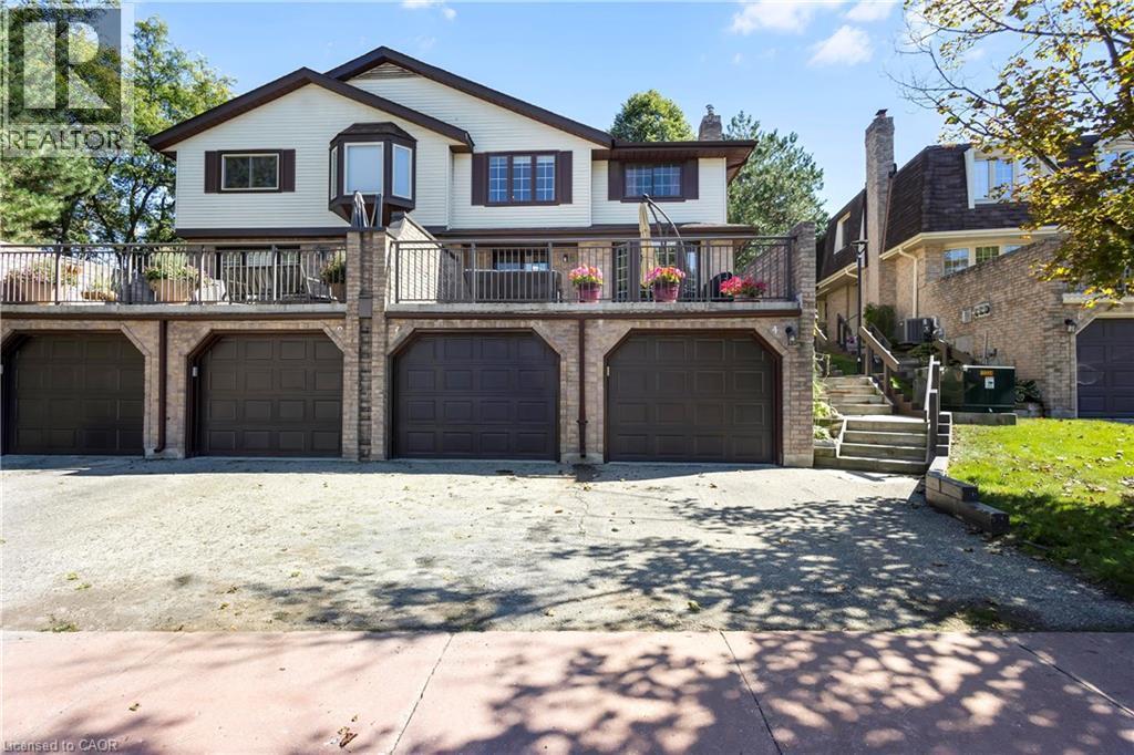 Multi-level residence featuring a prominent bay window and multiple balconies with metal railings - 475 Beechwood Drive Unit# 4, Waterloo, ON